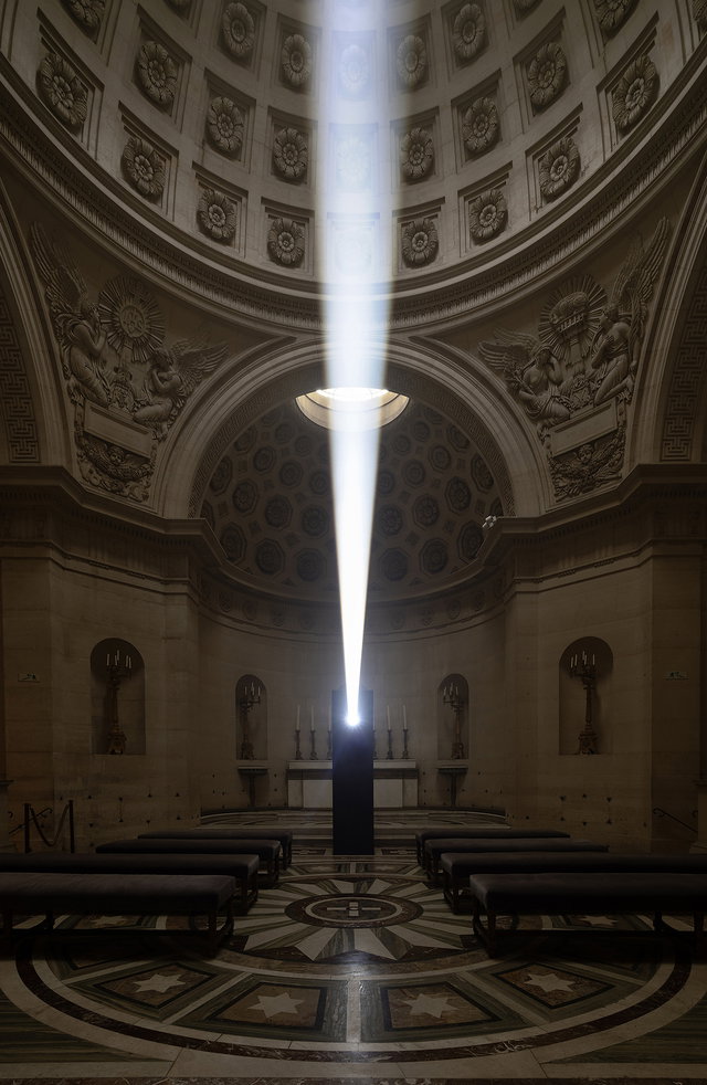 Light beam illuminating a domed neoclassical interior