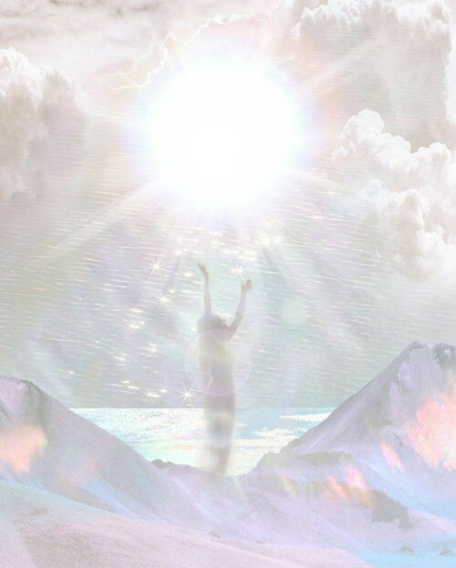 Silhouetted figure reaching toward radiant light
